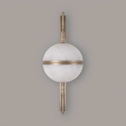 A clear frontal shot of the Andros wall lamp in aged brushed brass and alabaster against a solid grey background. The central orb is a full, perfect sphere of two alabaster halves separated by a horizontal brass ring. This view shows the perfect alignment of the vertical brass stem with the curved arms, and the uniform look of the natural alabaster in a passive state.