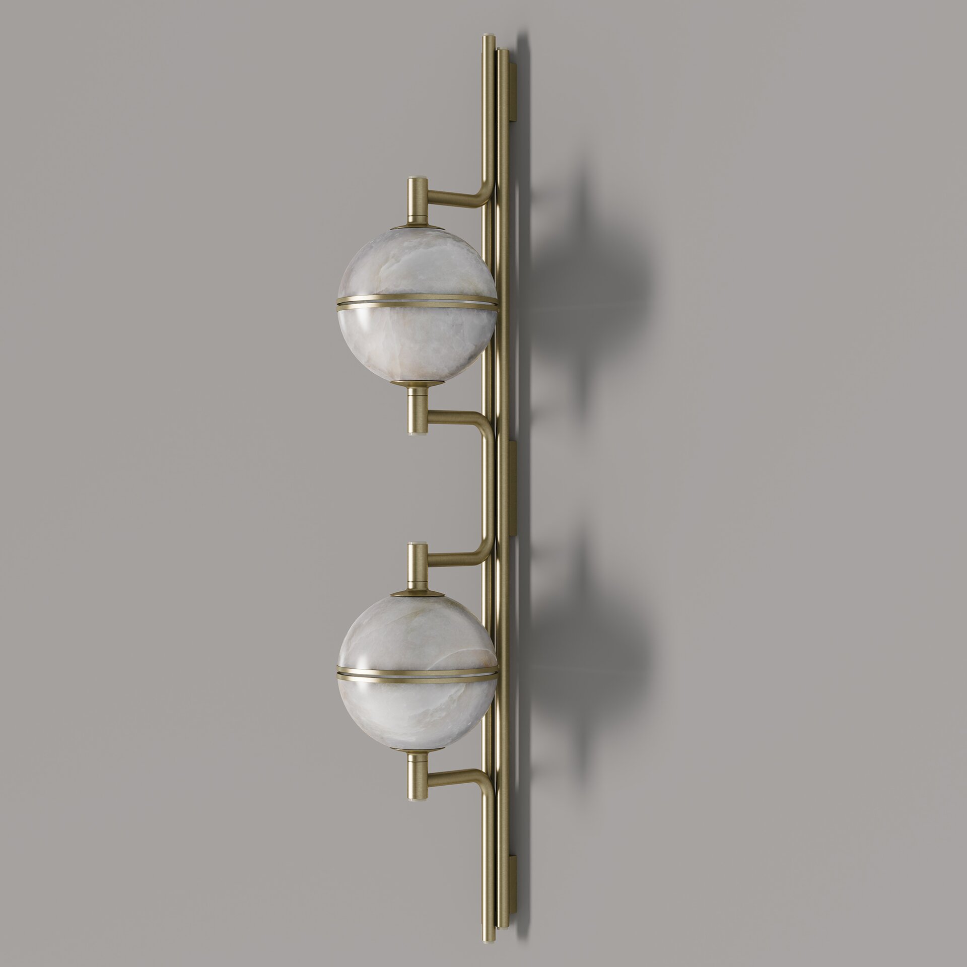 Andros II Wall Lamp Side view of the andros ii wall lamp, unlit, showcasing the natural veining of the alabaster globes and the sleek brushed brass hardware.