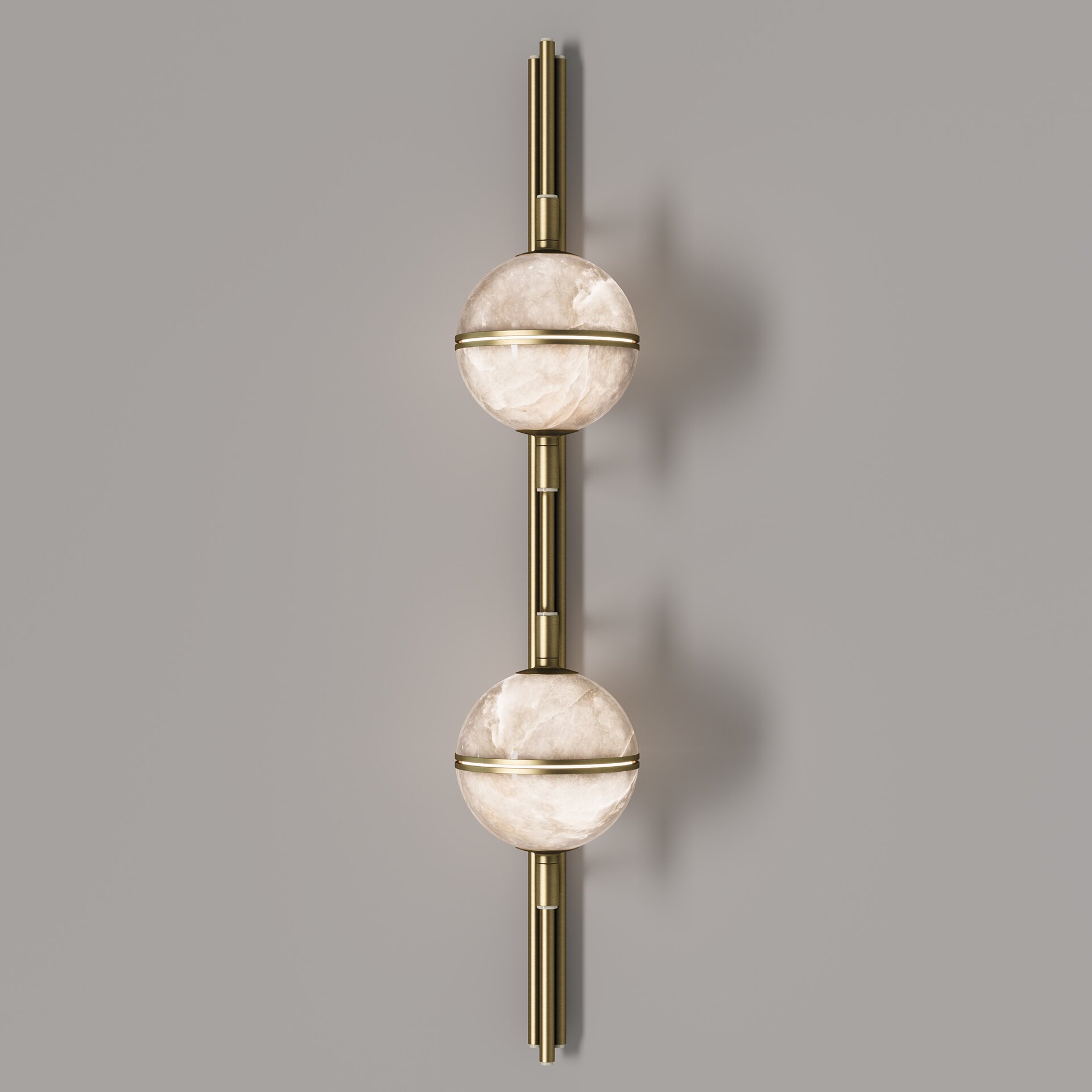 Andros II Wall Lamp Front view of the illuminated andros ii wall lamp, showing the warm glow through the translucent alabaster and the cream lacquered mounting.