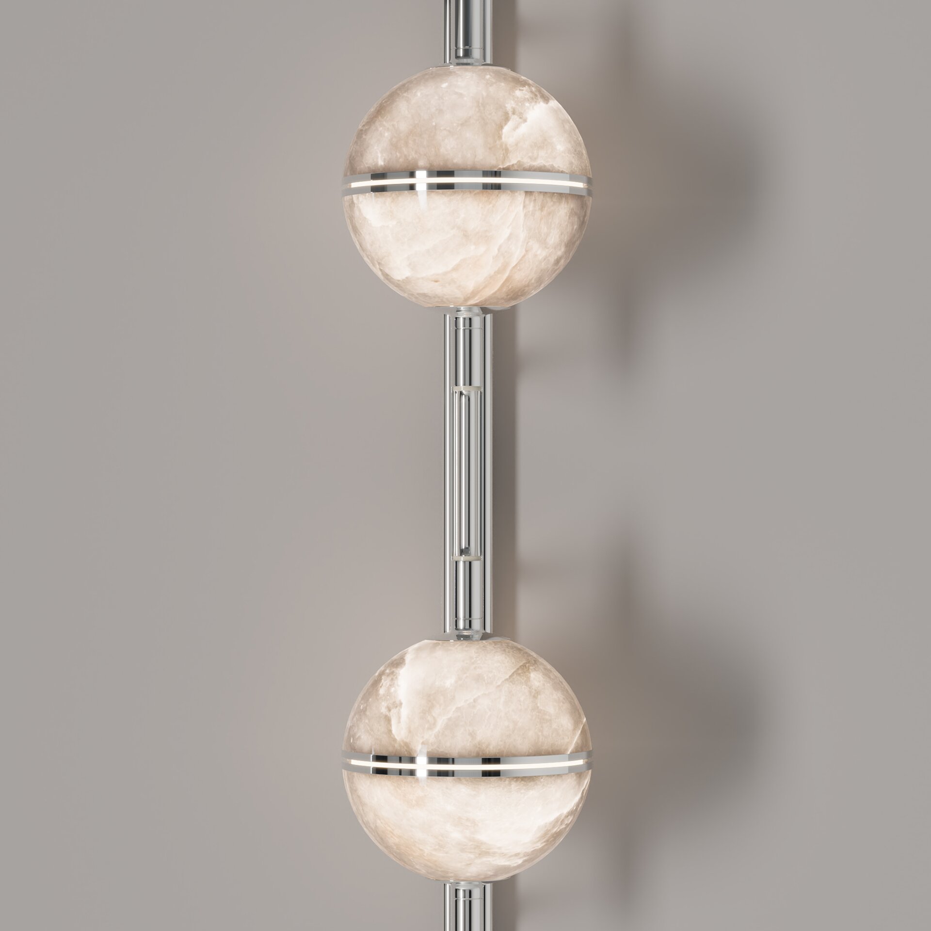 Andros II Wall Lamp Macro shot of the central vertical bar and illuminated alabaster globes in a silver-toned metal finish, showing the precision craftsmanship.