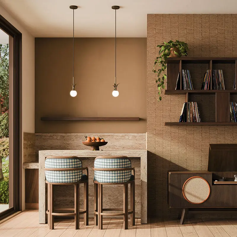 The berlin pendant lamp, made of brass with an opal glass shade, casts a warm glow over the living room setting. Nearby, the james bar chair, upholstered in a blue and white checker-pattern fabric, sits beside the harrison sideboard, crafted in walnut and showcasing a vinyl record player inside.