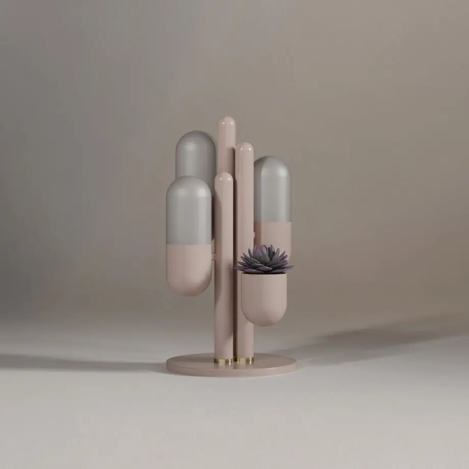 Cactus table lamp lacquered in rose beige, with the lights turned off and a succulent plant.