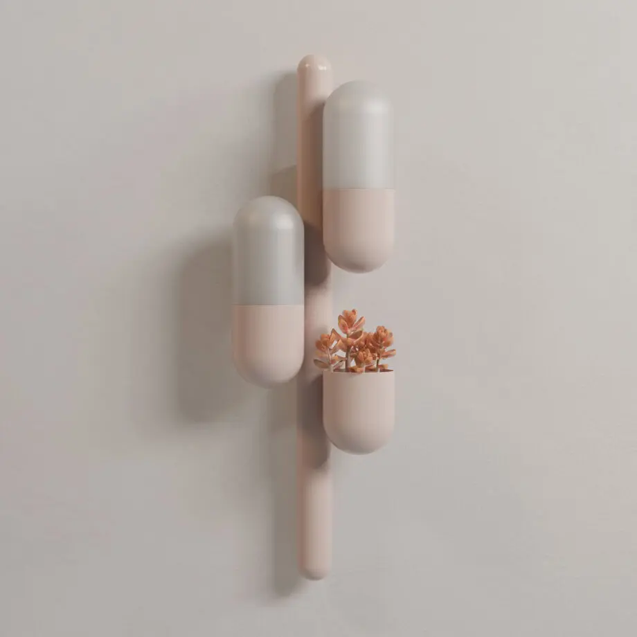 Cactus wall lamp with its two lights turned off, lacquered in rose beige with white glass shades. The piece also features a succulent orange plant.