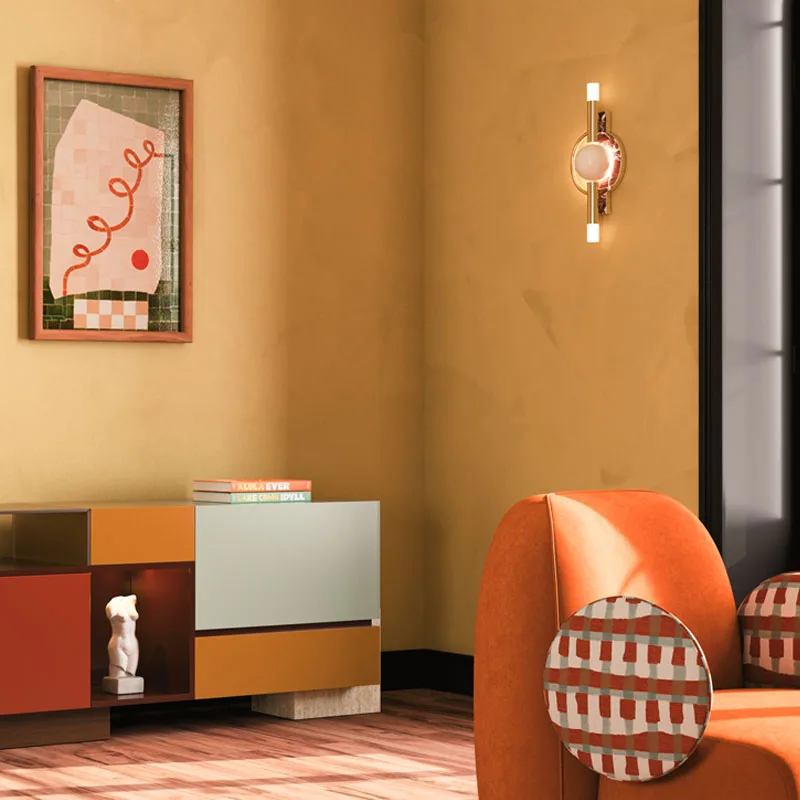 Dallas wall lamp in a living room setting featuring warm tones, including earthy colors and ambient lighting that enhances the cozy atmosphere.